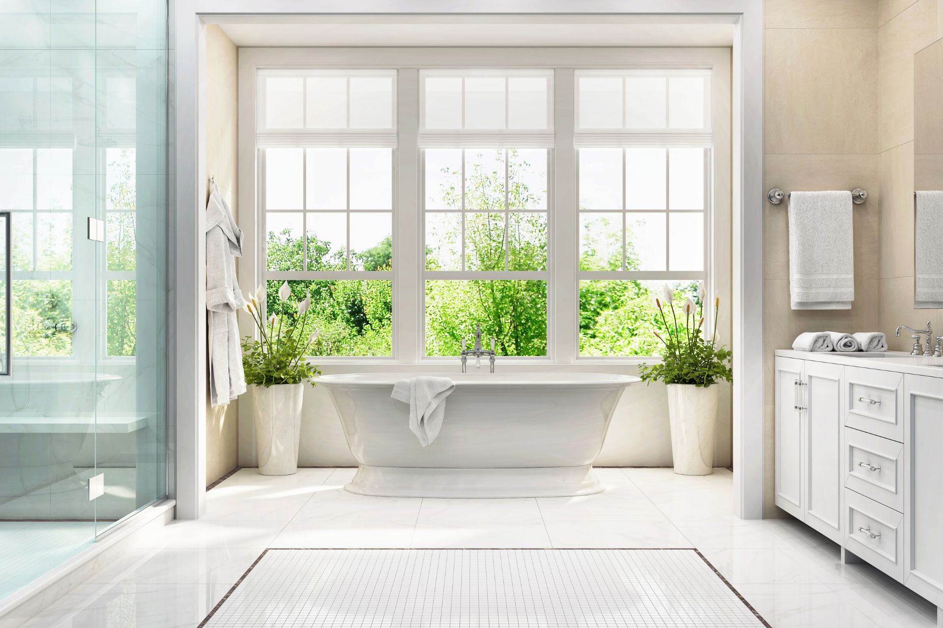 A bathroom with large windows, a bathtub, shower, and vanity areas